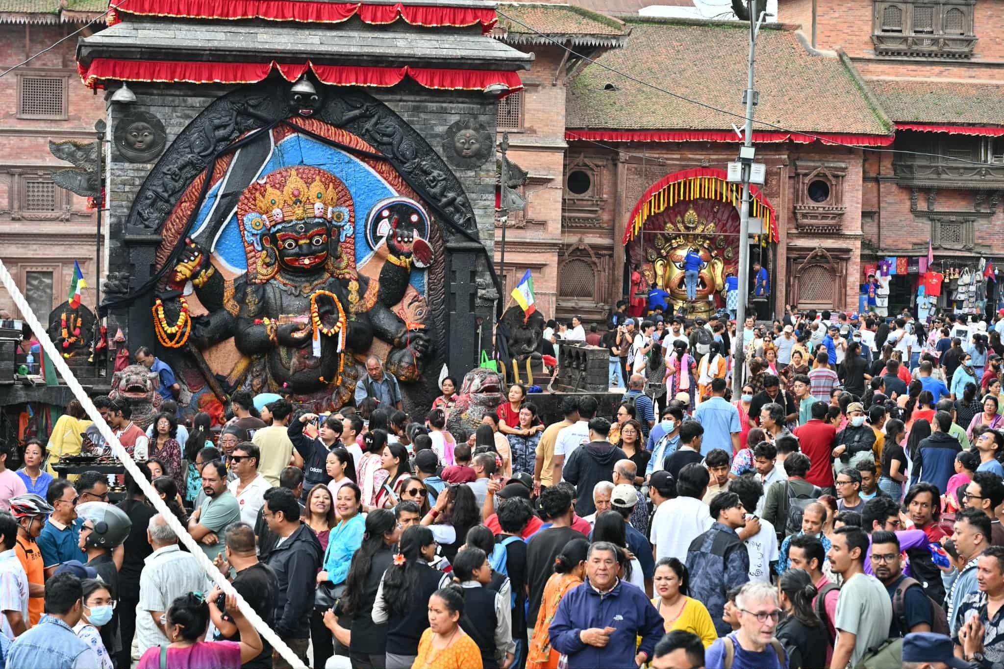 Crowd gathered around the ceremonial Lingo pole during its erection ceremony in Basantapur Square.