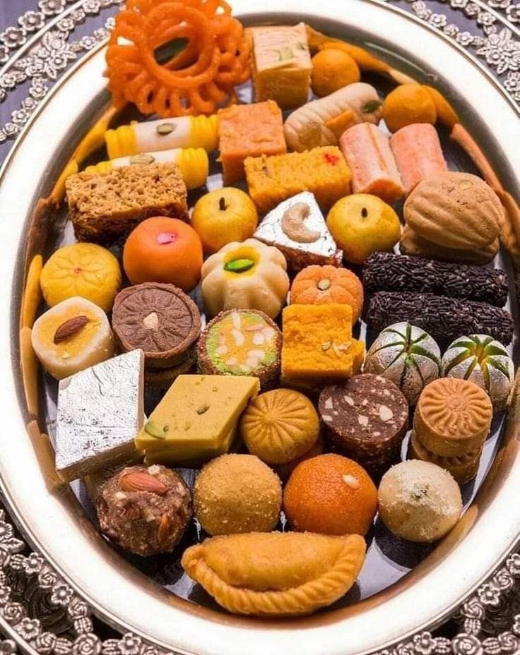A plate of traditional Maithili sweets like Peda and Anarsa from Janakpur