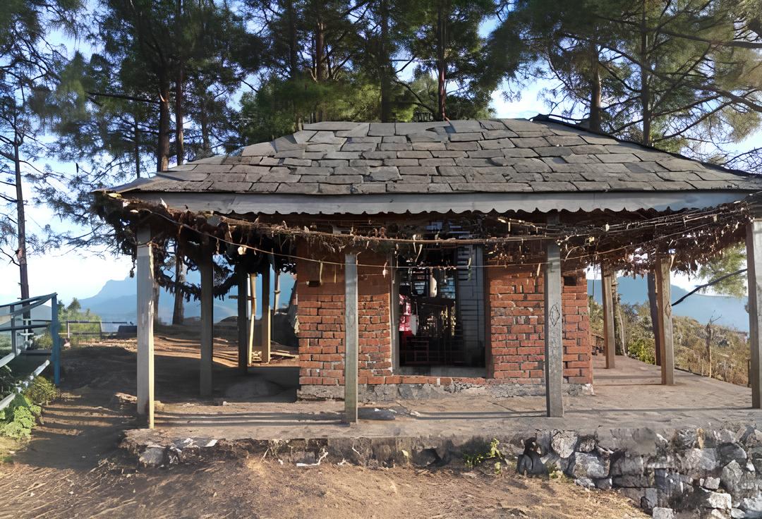 A view of the Thani Mai Temple and surrounding hills at sunset in Bandipur