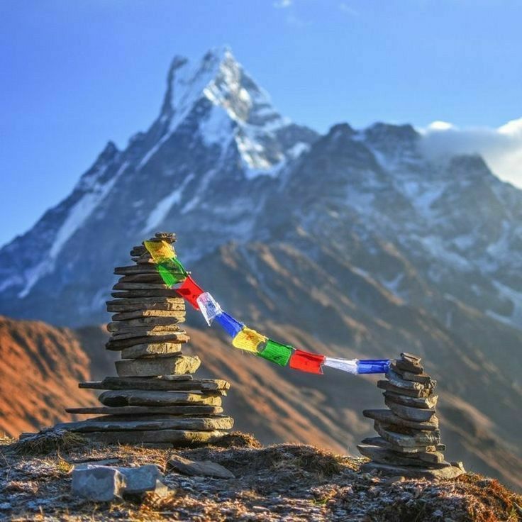 A high, rugged mountain pass in the remote Dolpo region of Nepal with prayer flags