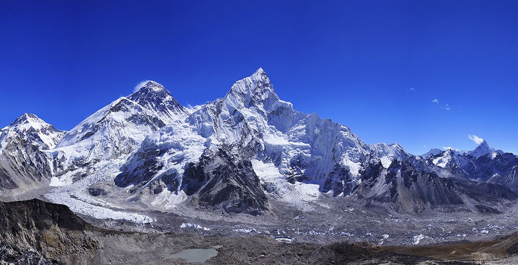 A panoramic view of the majestic Everest range with clear blue sky